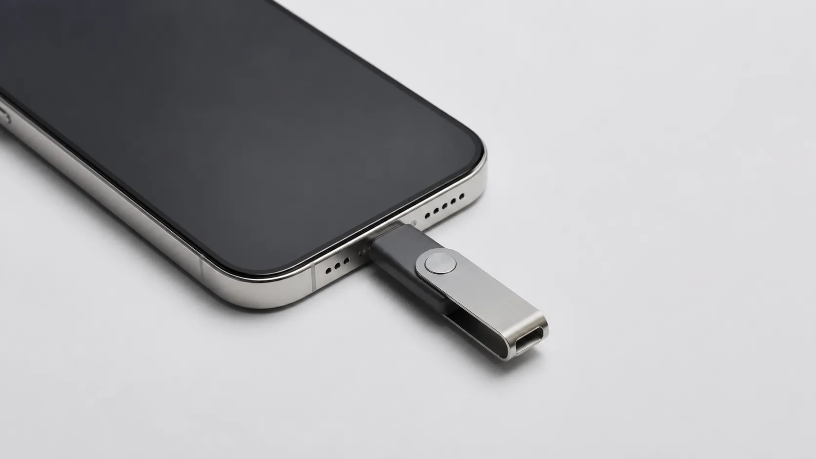 USB-C flash drive plugged into iPhone for direct photo backup without iCloud