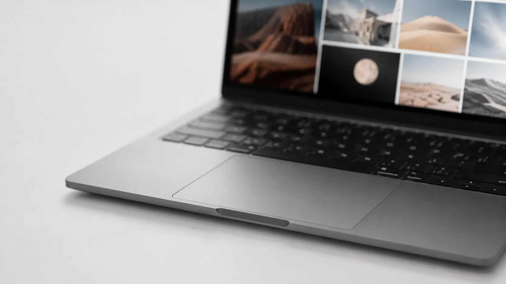 MacBook Pro keyboard and trackpad with free image viewer app open on screen
