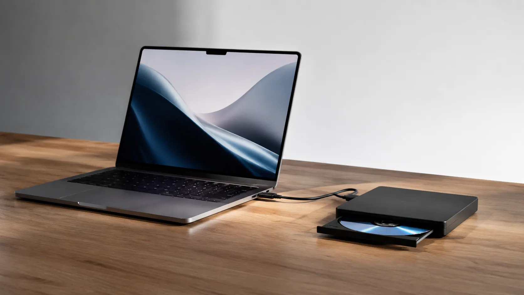 MacBook Pro connected to an external Blu-ray drive via USB-C cable for ripping Blu-ray discs on macOS