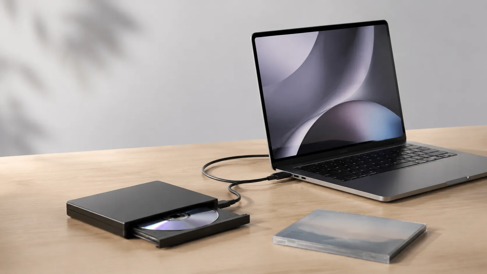 External DVD drive connected to a MacBook Pro for ripping DVDs on Mac