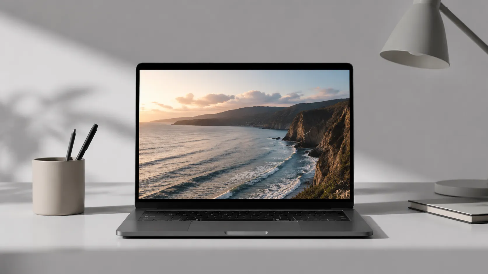 MacBook Pro on a clean desk displaying a paused 4K video, representing the best free YouTube downloaders for Mac in 2026
